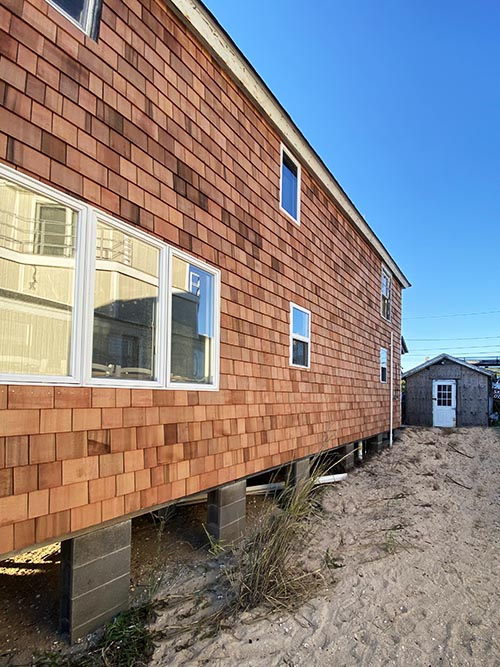 A cedar shake roof and siding job on Long Island