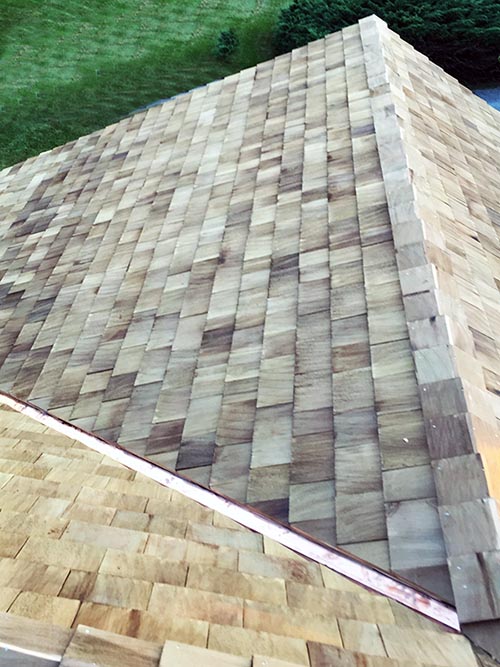 A cedar shake roof and siding job on Long Island