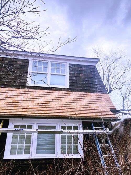 A cedar shake roof and siding job on Long Island