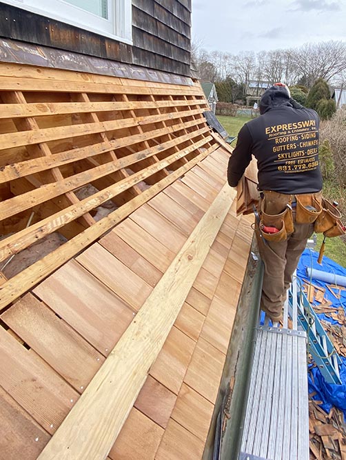 A cedar shake roof and siding job on Long Island